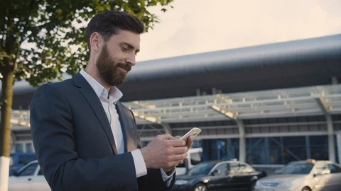 Bearded Smiled Man in Classical Suit walking near modern Business Building.  Stock Footage 111076208