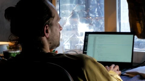 Bearded software developer works on laptop and coding application Stock Footage 105336844