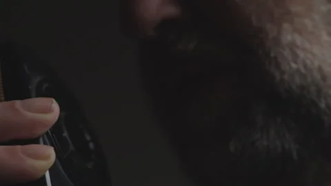 Bearded Spy Transmitting Secret Intelligence Through Radio in Deep Shadows Stock Footage 337865831