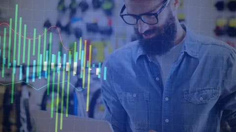 Bearded store specialist typing laptop data in bike store showroom, generating Stock Footage 327445244