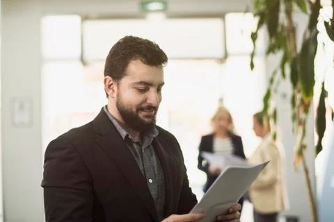 Bearded suit man posing in office workplace Stock Photos