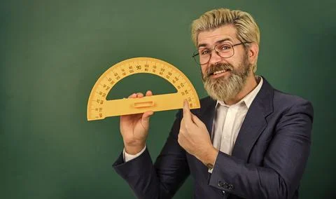 Bearded tutor at chalkboard. Teaching about angles. Mathematics for better Stock Photos