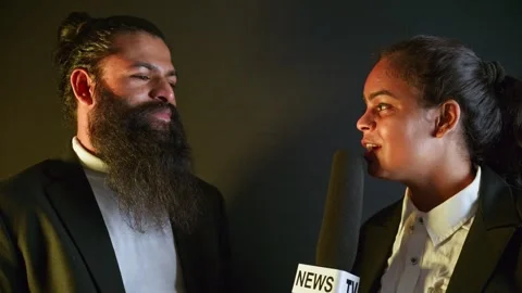 Bearded Tycoon Gives Live Interview with Lady TV Reporter Stock Footage 312728475