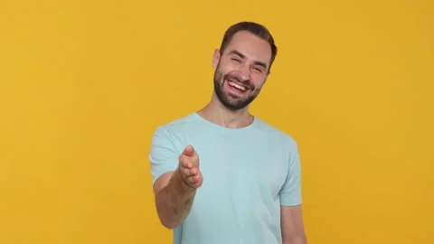 Bearded young man 20s in basic casual blue t-shirt isolated on yellow background Stock Footage 148283113