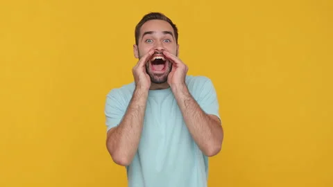 Bearded young man 20s in basic casual blue t-shirt isolated on yellow background Stock Footage 148285679