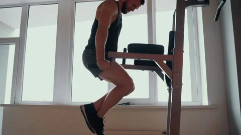 The bearded young man performs the lifting of the body, positioned with his Stock Footage 156698020