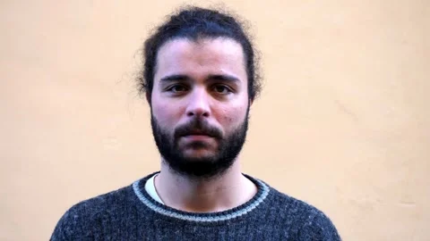Bearded young man shakes head no in clear disagreement Video stock 328644685