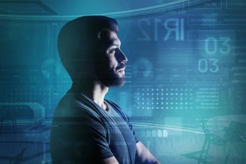 Bearded young programmer standing in his modern office and thinking Stock Photos