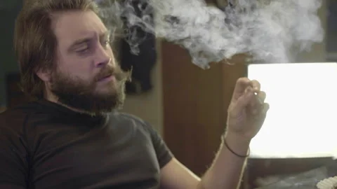 Beardy Man Smoking on PC Stock Footage 143187001