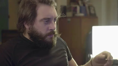Beardy Man Writing on PC Video stock 143187213