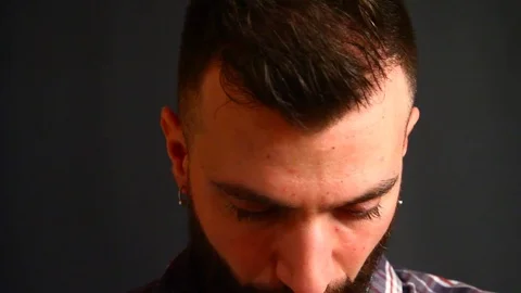 Beared man smoking electronic cigarette Stock Footage 72852664