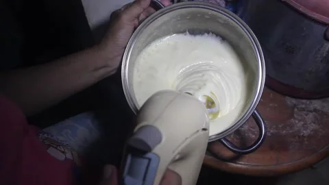 Beat the cookie dough using a mixer Stock Footage 272286240