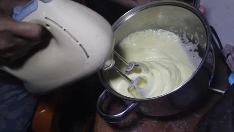 Beat the cookie dough using a mixer Stock Footage 272286252