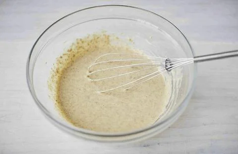 Beat the dough until smooth. Seal the bowl with cling film and leave in a war Stock Photos