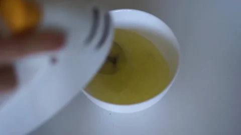 Beat an egg with a blender Stock Footage 258305047