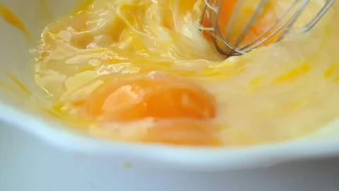 Beat egg with mixer slow motion Stock Footage 115826275