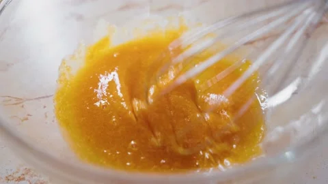 Beat Egg Yolks With Sugar With A Hand Whisk In A Bowl. The Process Of Stock Footage 237972559