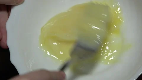 Beat eggs in a bowl Stock Footage 145709072