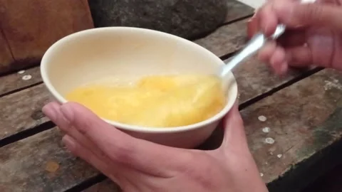 Beat the eggs with a spoon Stock Footage 139429768