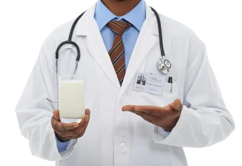 Beat osteoporosis with a glass a day. Cropped view of a doctor endorsing a glass Stock Photos