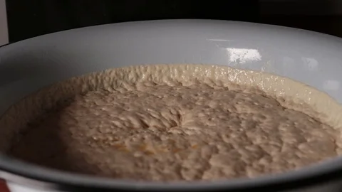 Beaten eggs are introduced into the dough Stock Footage 124960059