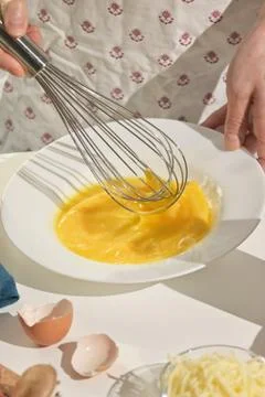 Beaten Eggs to Prepare An Omelette Stock Photos