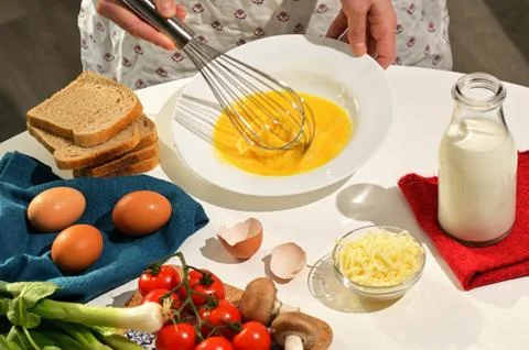 Beaten Eggs to Prepare An Omelette Stock Photos
