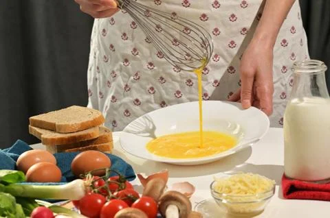 Beaten Eggs to Prepare An Omelette Stock Photos