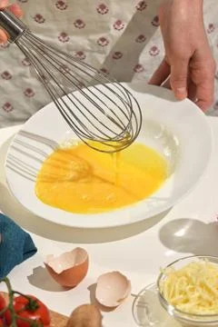 Beaten Eggs to Prepare An Omelette Stock Photos