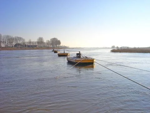 Beaters of cable anchor of ferry in river rhine Stock Photos