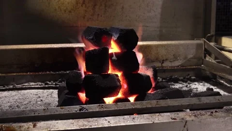 Beatiful closeup of a hexagon shaped pile of coals with hole in the middle on a 스톡 동영상 186226589