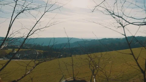 Beatiful Countryside View with Branches in Foreground | HD Stock Footage 88482915