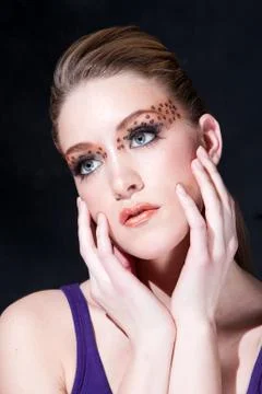 Beatiful face with Leopard print eyes Stock Photos