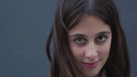 Beatiful Girl Looking At The Camera And Moving Her Hair Stock Footage 183040887