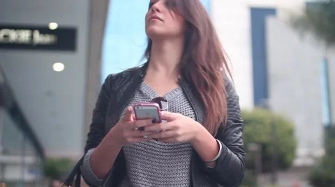 Beatiful Girl with Smartphone on the Street Stock Footage