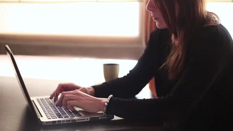 Beatiful woman works with the computer Video stock 70618835