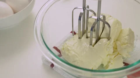 Beating cream cheese with eletric beater Stock Footage 133462266