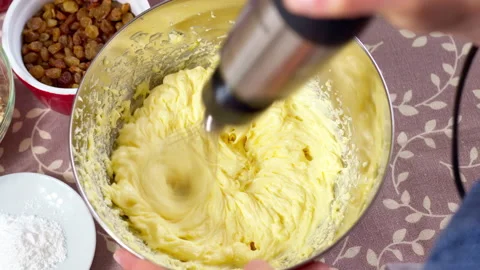 Beating the dough with a mixer. 4K. Stock Footage 155016668