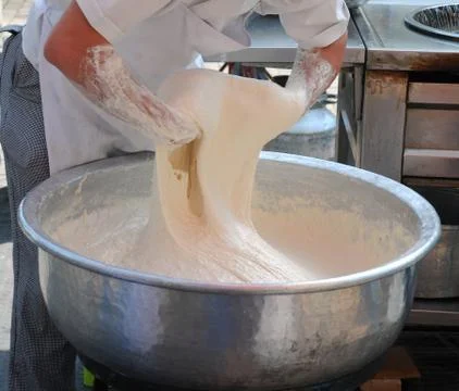 Beating dough Stock Photos