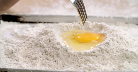 Beating egg into flour Stock Footage 55879747