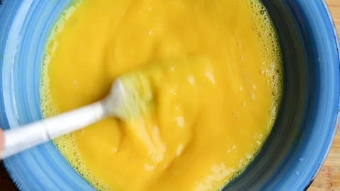 Beating an egg with a fork. cooking pasta carbonara. food preparation. close-up Stock Footage 256688470