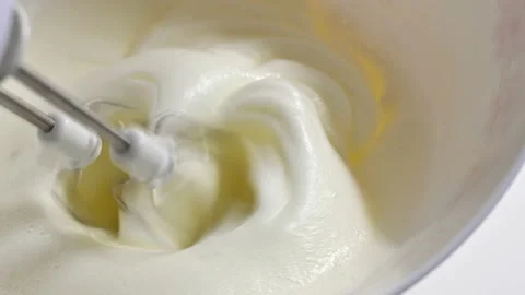 Beating the egg whites to make the pudding Stock Footage 228220989