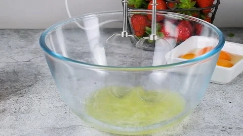 Beating egg whites with a mixer Stock Footage 256606492