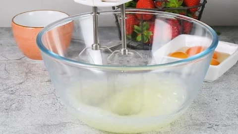 Beating egg whites with a mixer Stock Footage 256606494