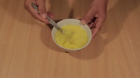 Beating Eggs in a Bowl Stock Footage 68494294