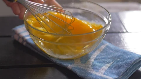 Beating of eggs in a bowl. Slow motion. Stock Footage 106472417