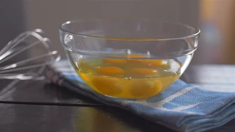 Beating of eggs in a bowl. Slow motion. Stock Footage 106472463