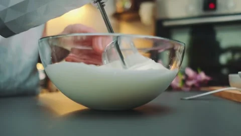 Beating eggs with a mixer in a fluffy foam Stock-Footage 249078948