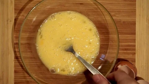Beating eggs for omelet Video stock 72102218