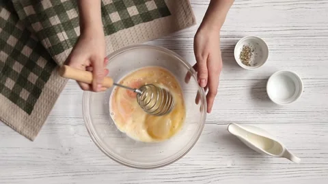 Beating eggs for omelet, recipe step by step, top view Stock Footage 150812790